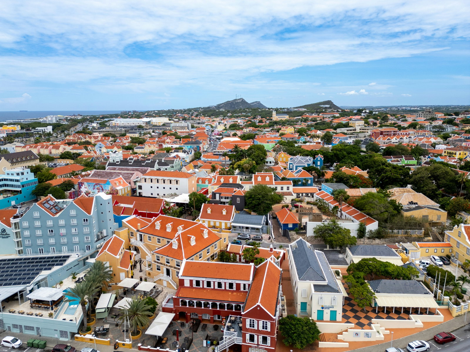 Colorful Dutch colonial buildings lining the waterfront along Santa Anna Bay in Willemstad, Curaçao.