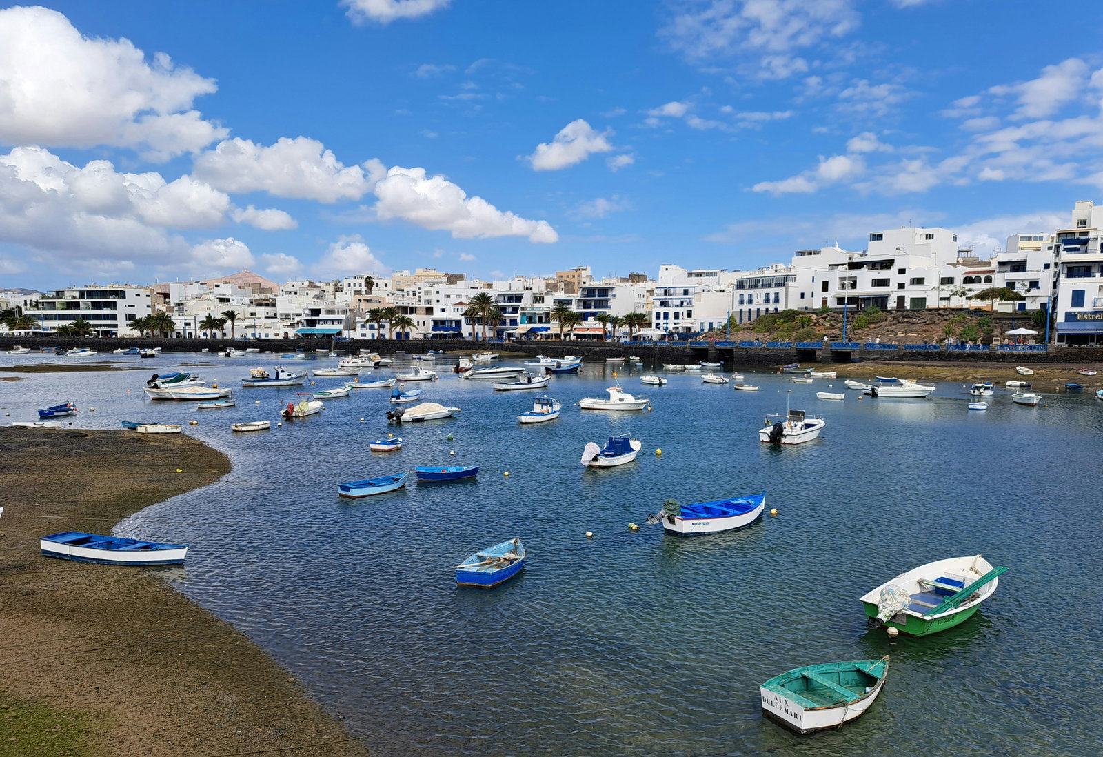Volcanic landscape with a cruise ship docked in the port of Arrecife, Lanzarote.