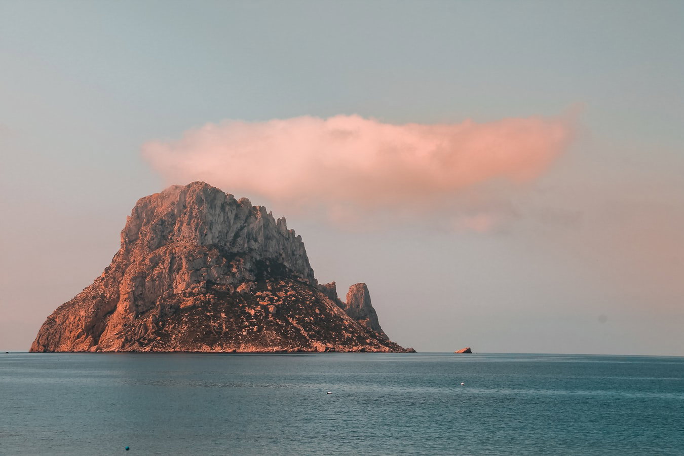 Ancient Dalt Vila walls overlooking the modern harbor and city of Ibiza.