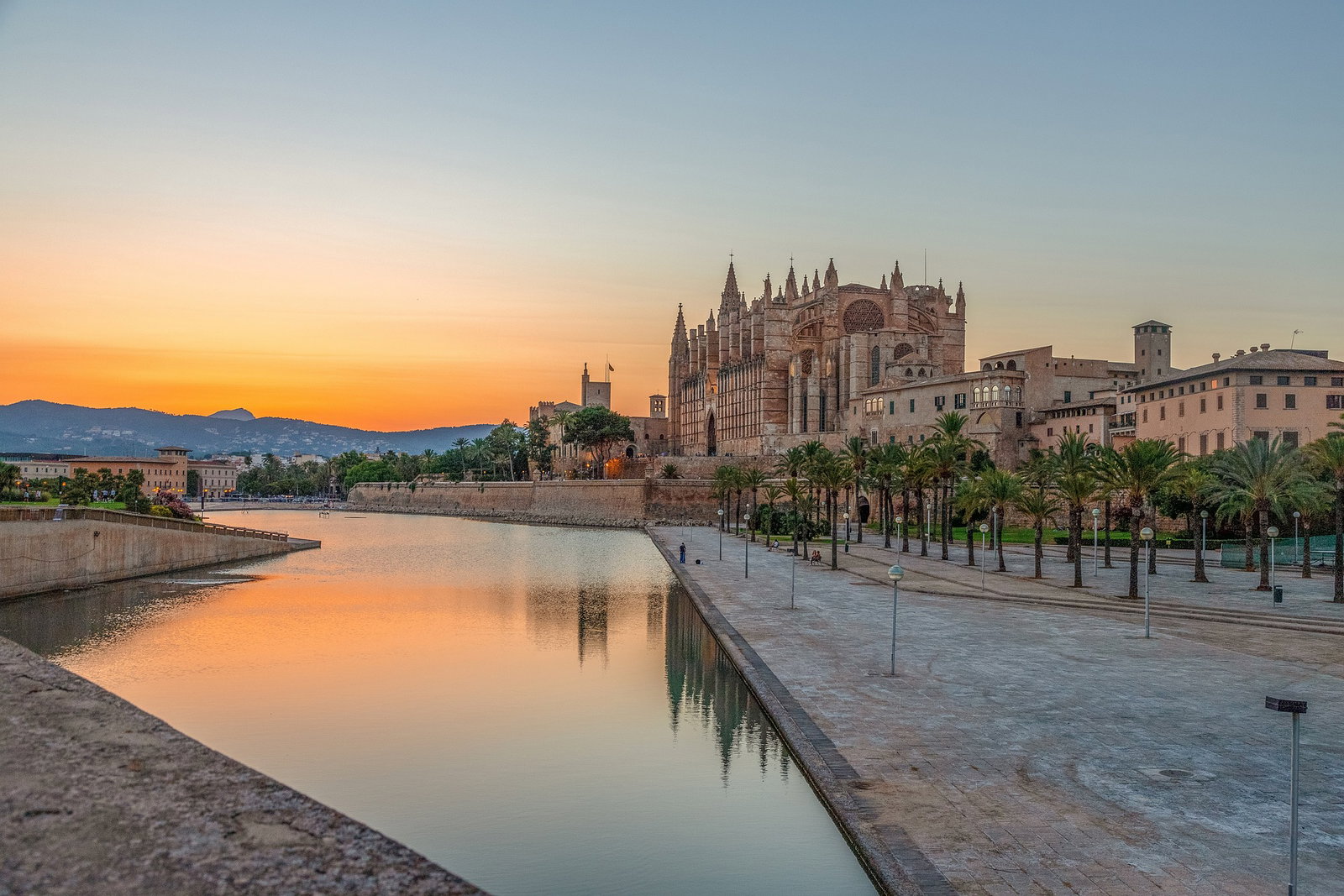 Golden sandstone La Seu Cathedral rising above Palma de Mallorca's waterfront.