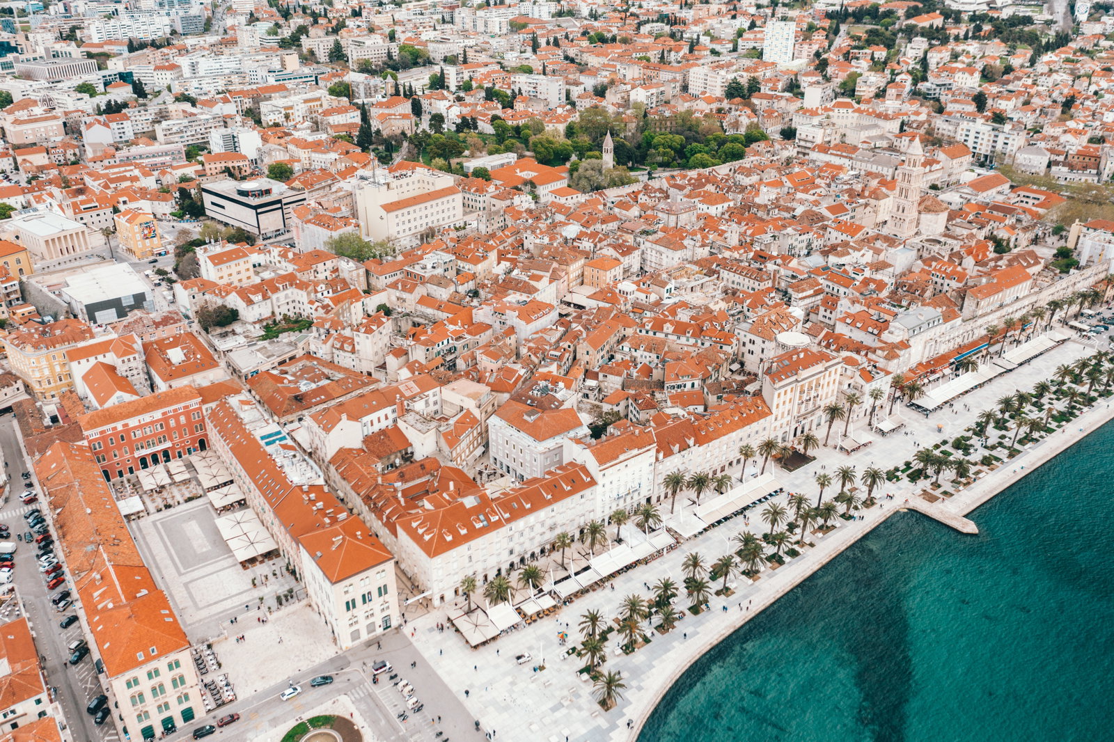 View of Diocletian's Palace in Split, Croatia, with people walking below.