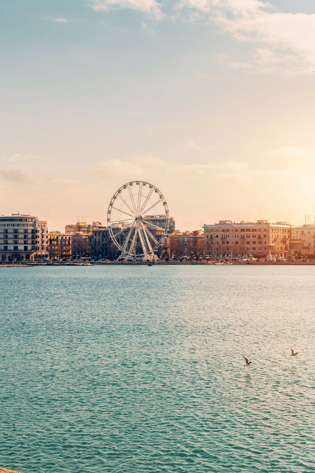 Panoramic view of Bari's historic Old Town and bustling harbor on the Adriatic Sea.
