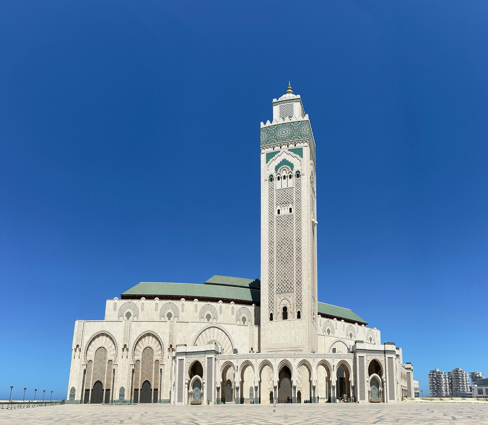 Busy street scene in Casablanca with historic buildings and people walking