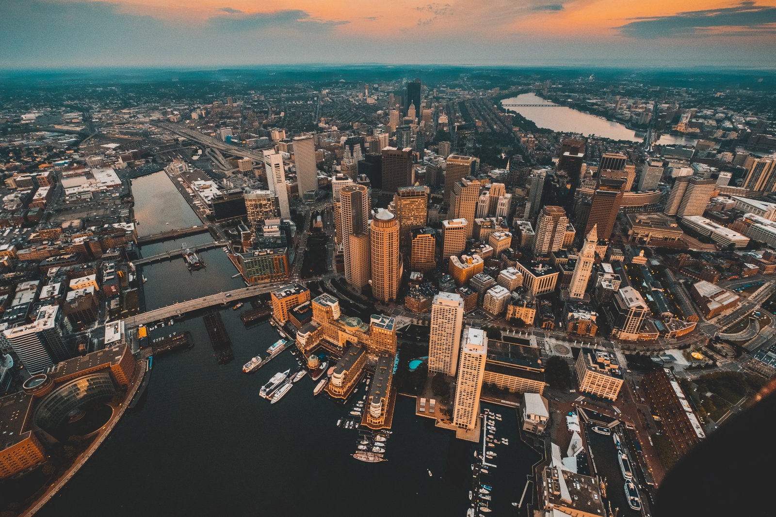 Historic cobblestone street leading to modern skyscrapers in Boston, Massachusetts