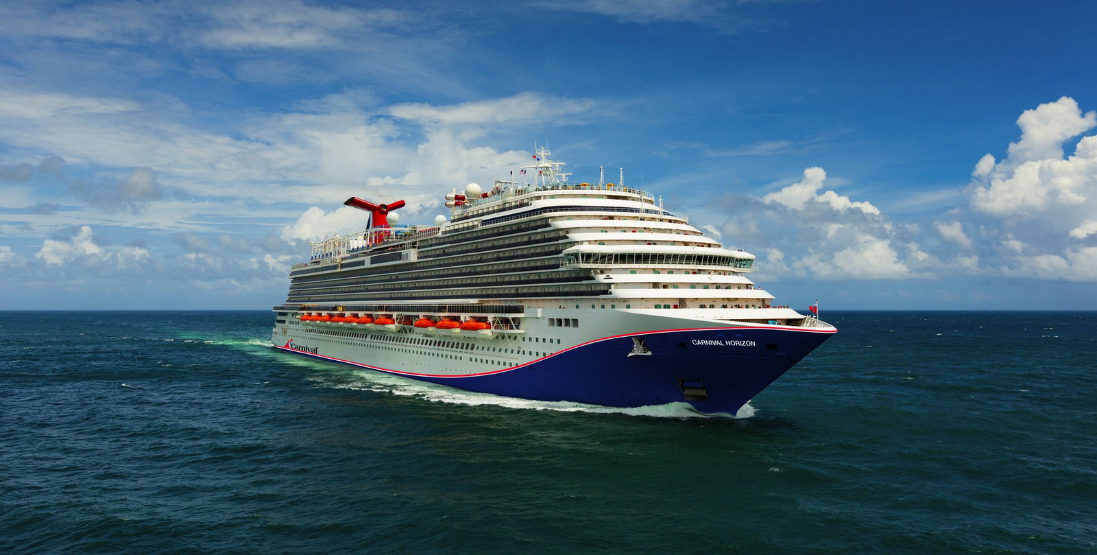 Families enjoying the thrilling Twister Waterslide at Carnival Horizon's WaterWorks.