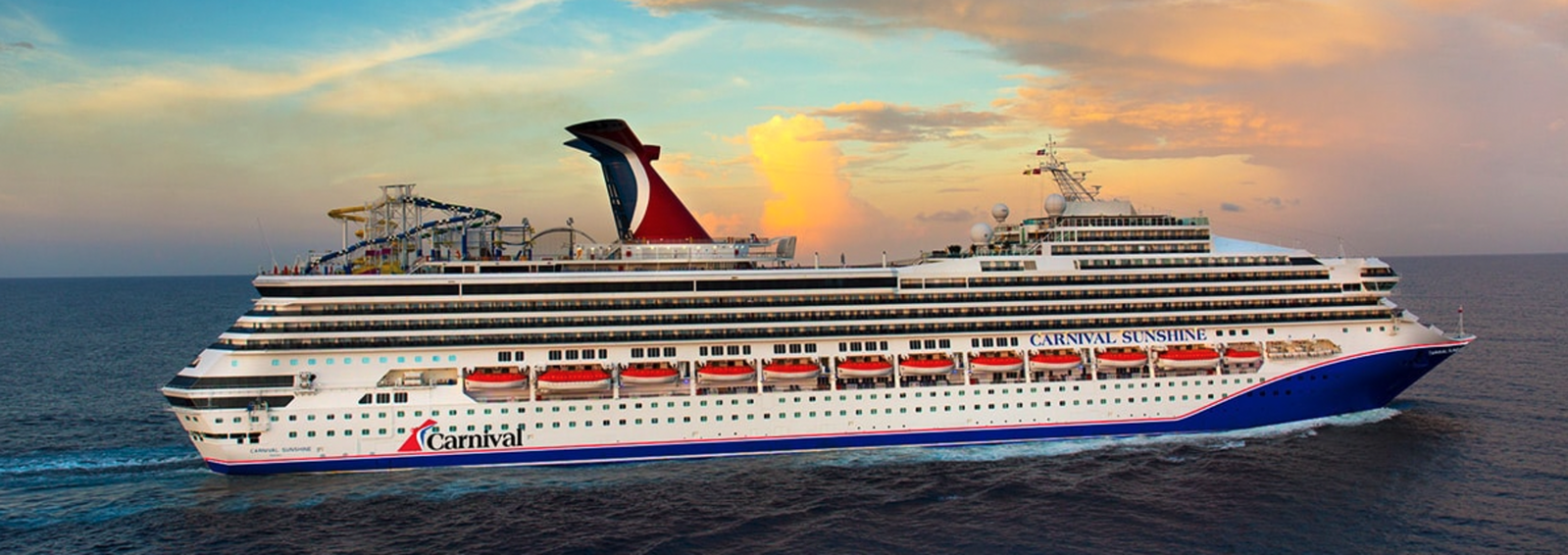 Carnival Sunshine cruise ship sailing on blue ocean waters under a clear sky.