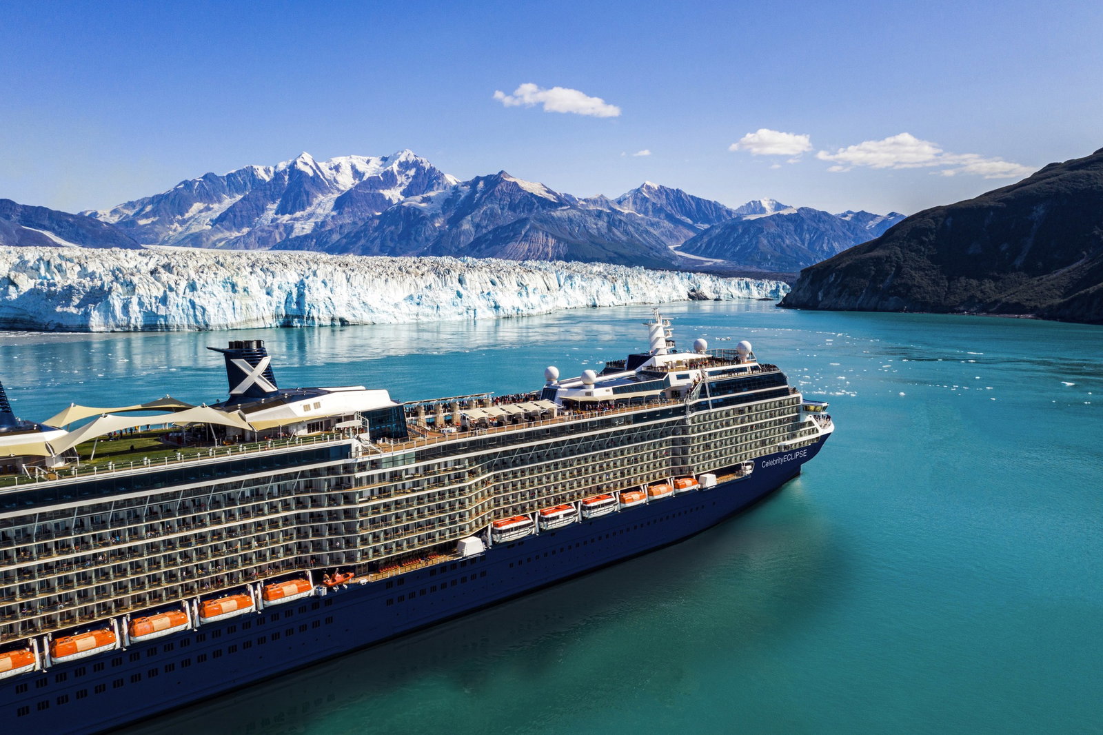Celebrity Eclipse cruise ship sailing on calm blue waters at sunset