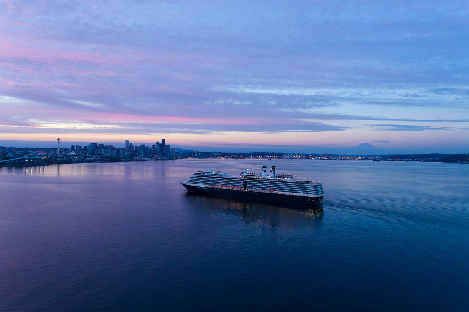 Elegant cruise ship Eurodam sailing on calm waters at sunset