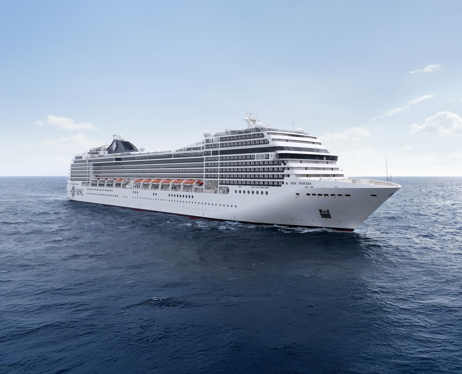 MSC Poesia cruise ship sailing on open water under a blue sky
