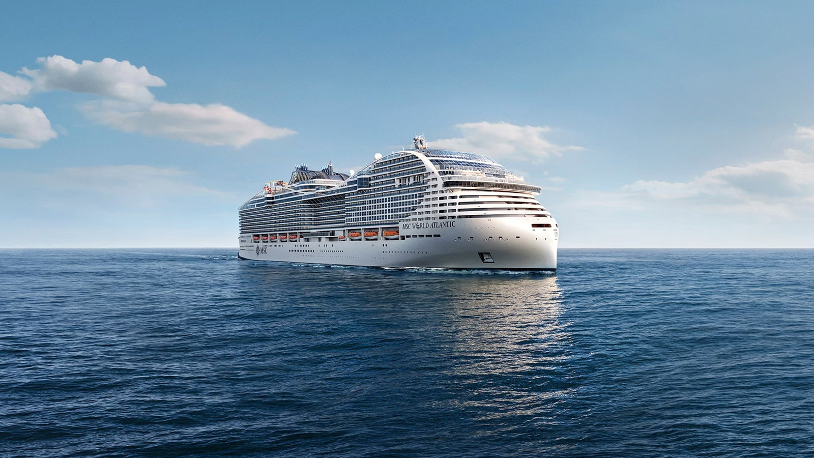 Large cruise ship MSC World Atlantic sailing through calm Caribbean waters at sunset