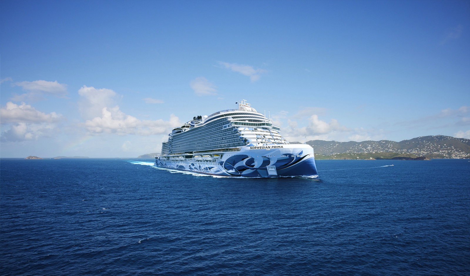 Aerial view of Norwegian Prima cruise ship with a multi-level race track on deck.