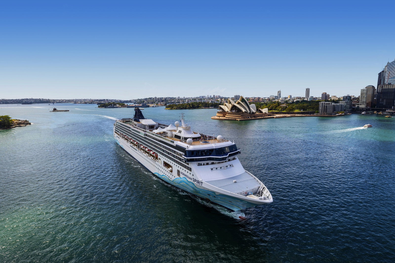Norwegian Spirit cruise ship sailing at sea under a clear sky.