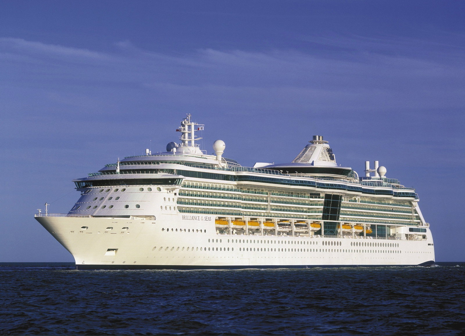 Royal Caribbean's Brilliance of the Seas sailing on a sunny day with ocean views.