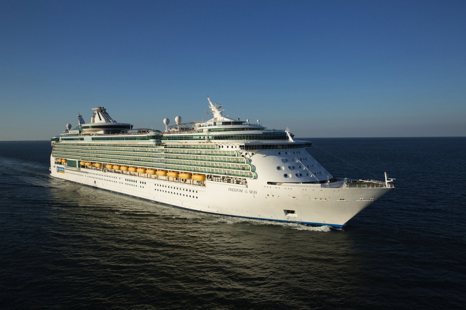 Royal Caribbean Freedom of the Seas ship sailing on blue ocean.