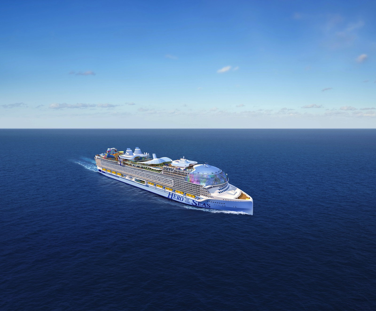 A large Royal Caribbean cruise ship with multiple decks, pools, and water slides under a blue sky.