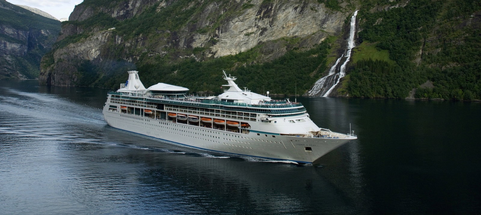 Royal Caribbean Vision of the Seas cruise ship at sea during sunset.