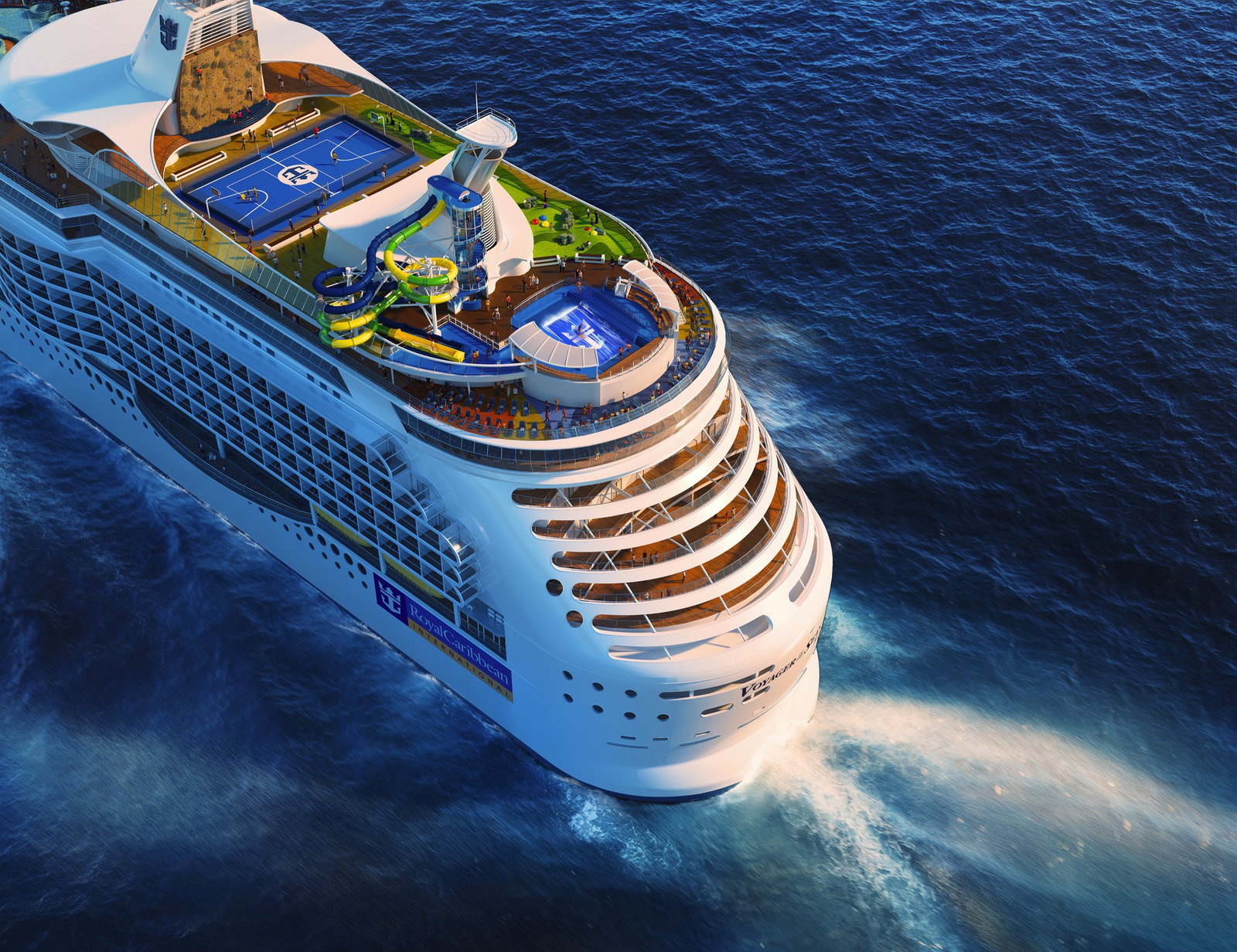 Families enjoying waterslides and pool activities on the deck of Voyager of the Seas.